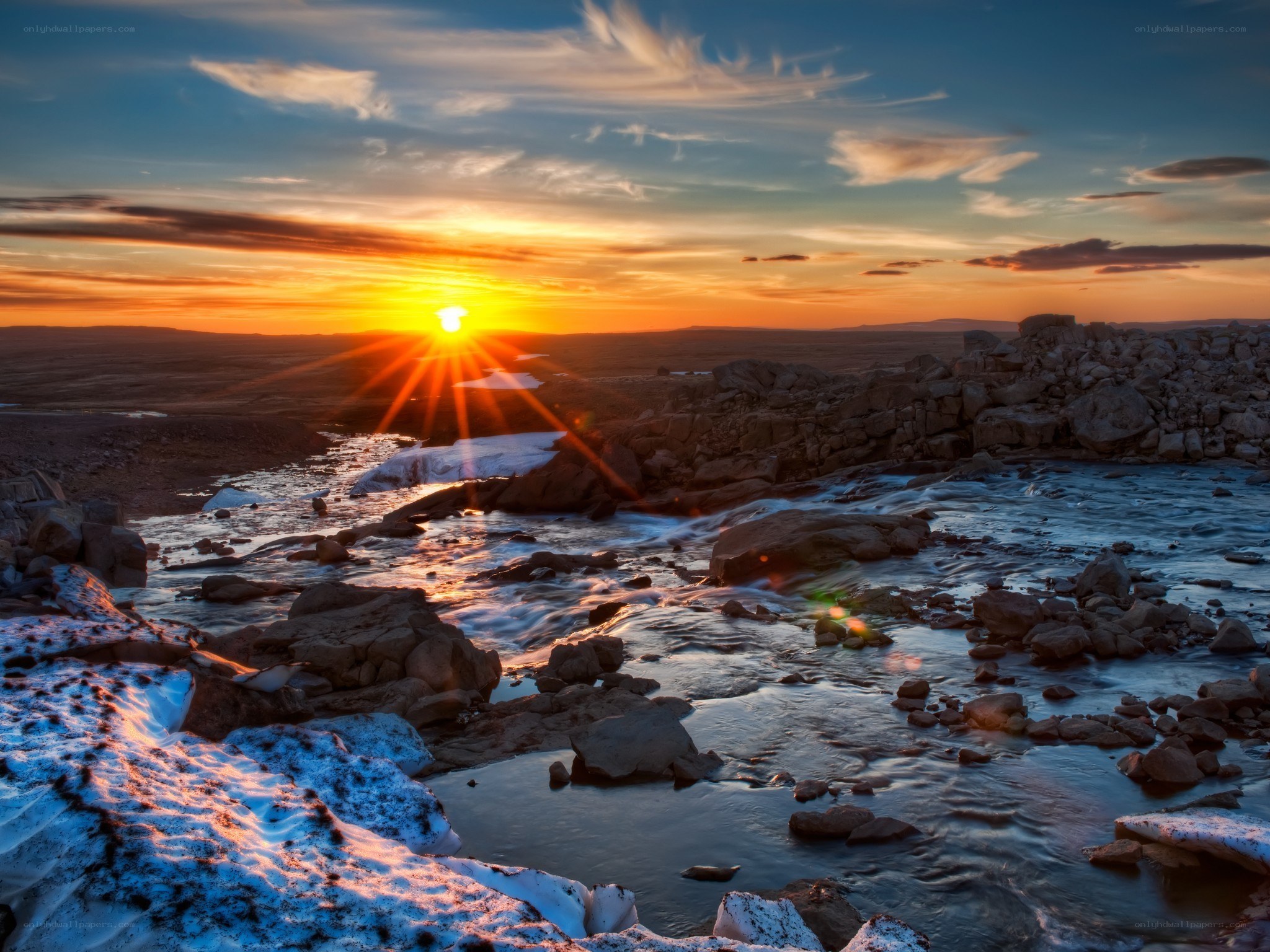 Sunset over a rocky river