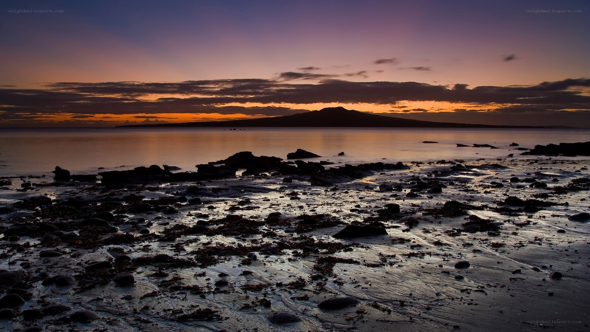 sunset over a rocky shore