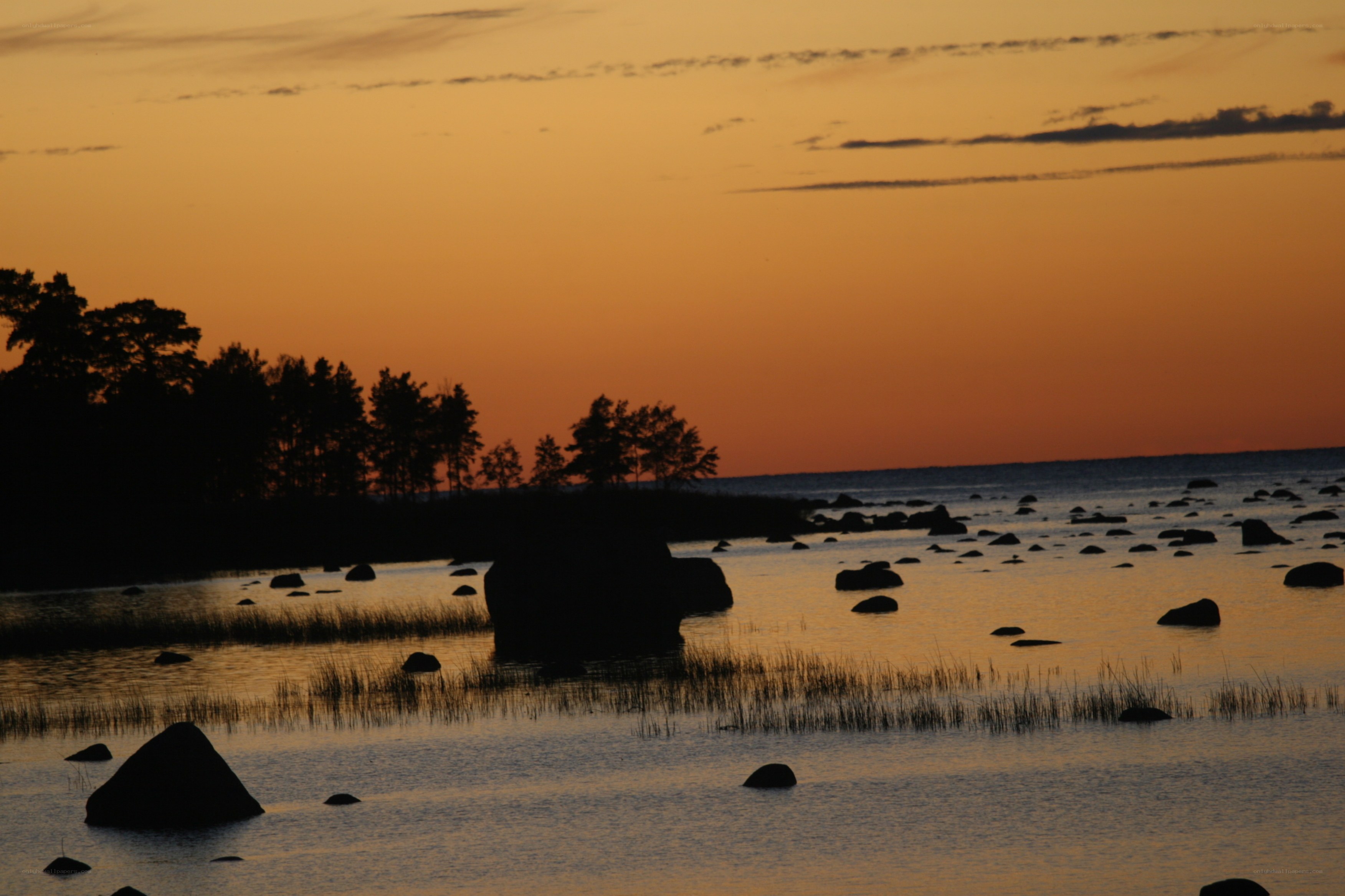 Sunset over a rocky shoreline