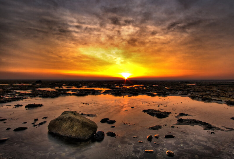 Sunset over a rocky shoreline