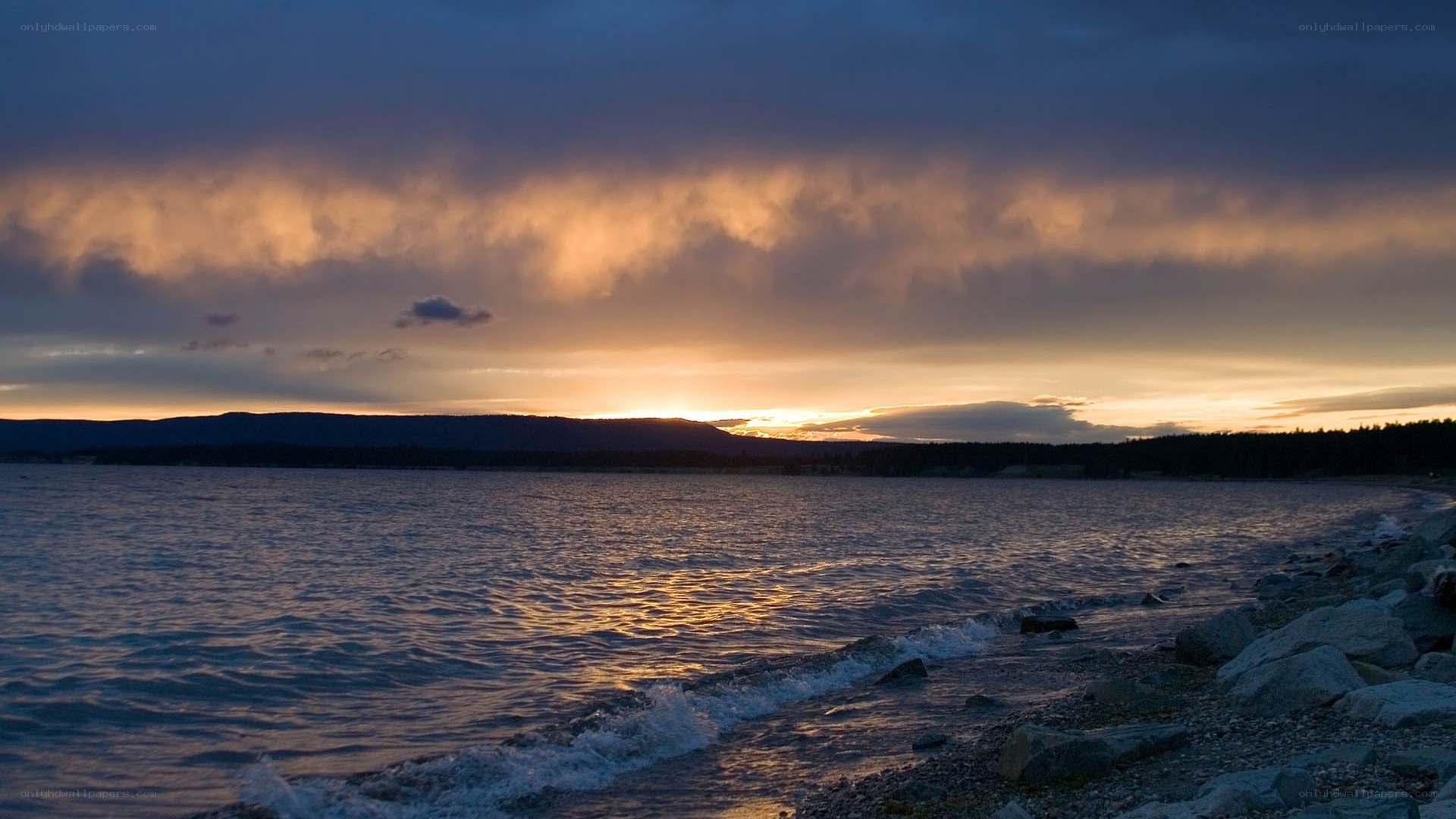 Sunset over a rocky shoreline