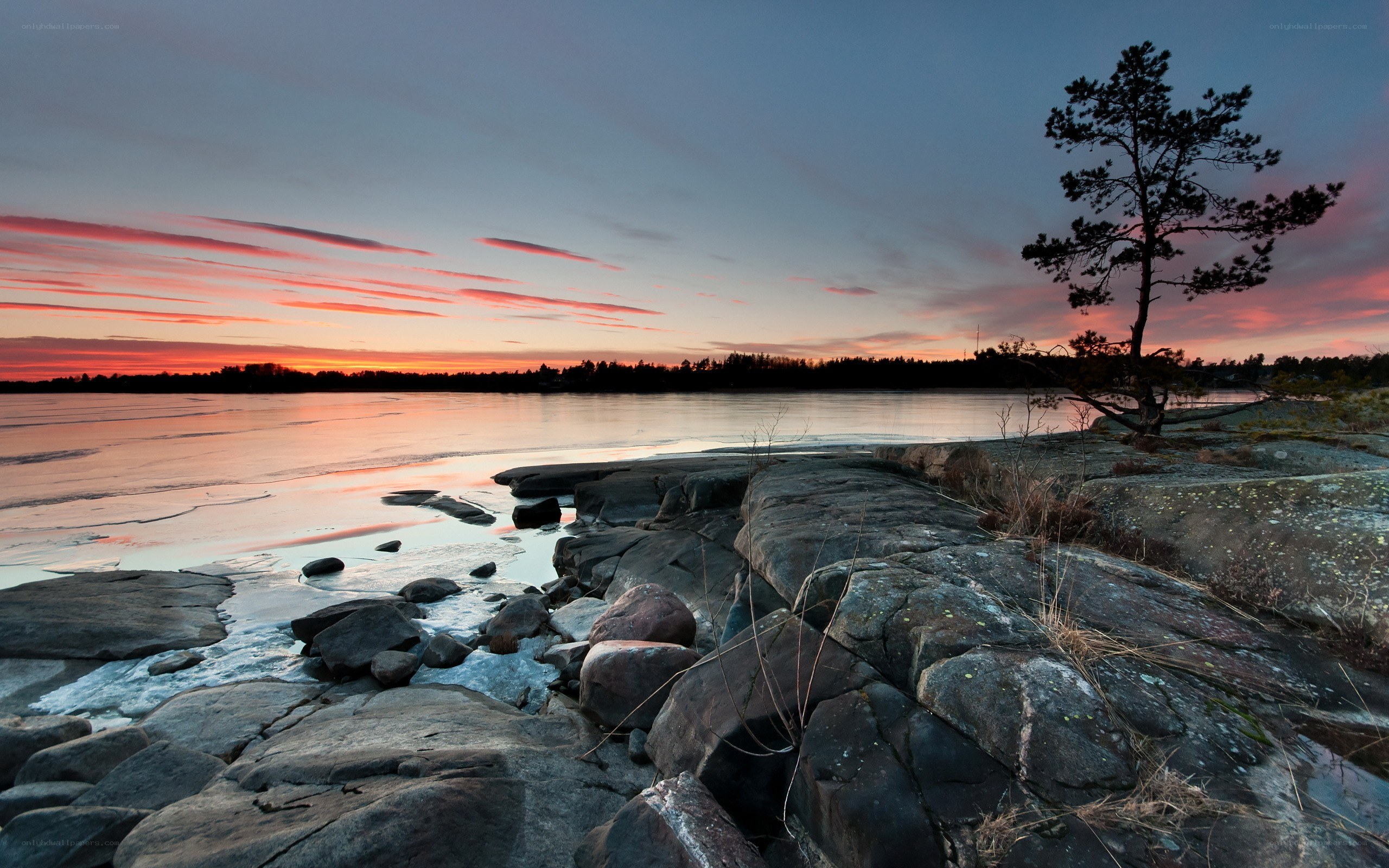 Sunset over a rocky shoreline