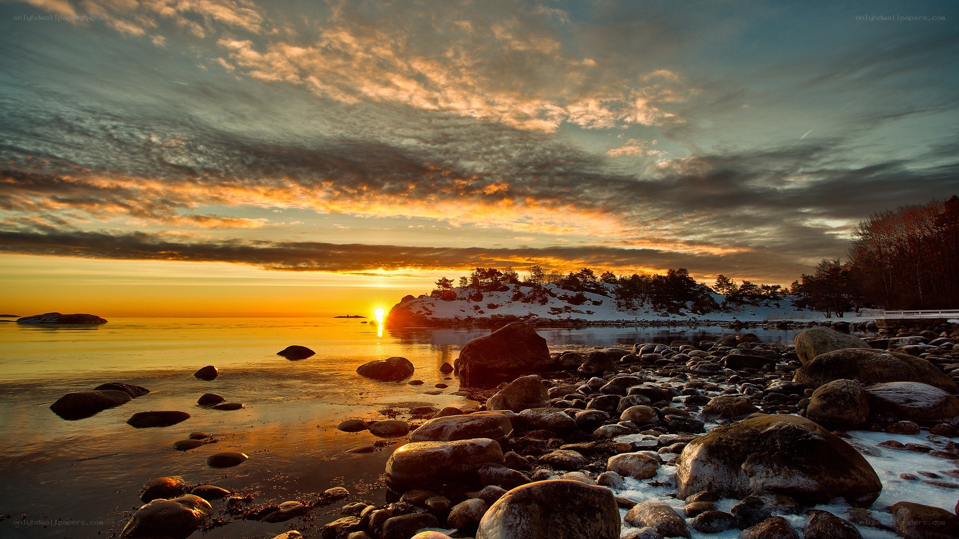 Sunset over a rocky shoreline
