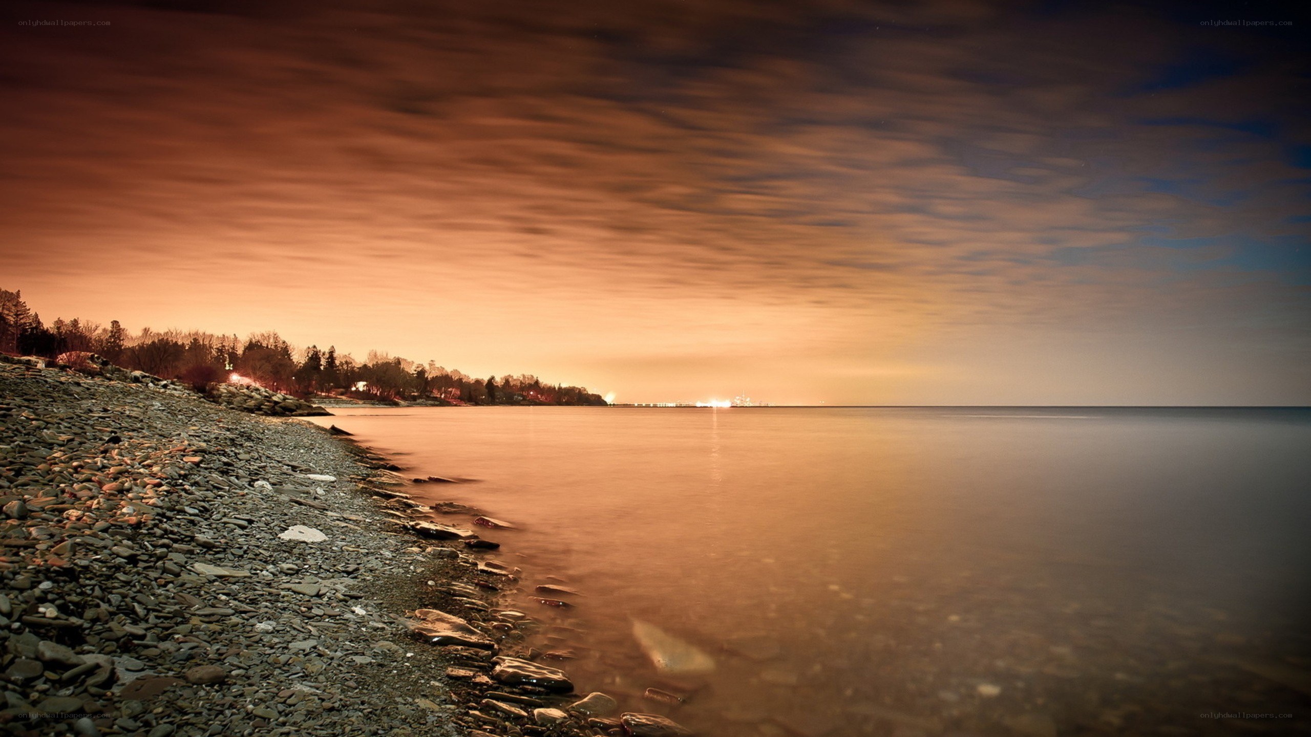 Sunset over a rocky shoreline