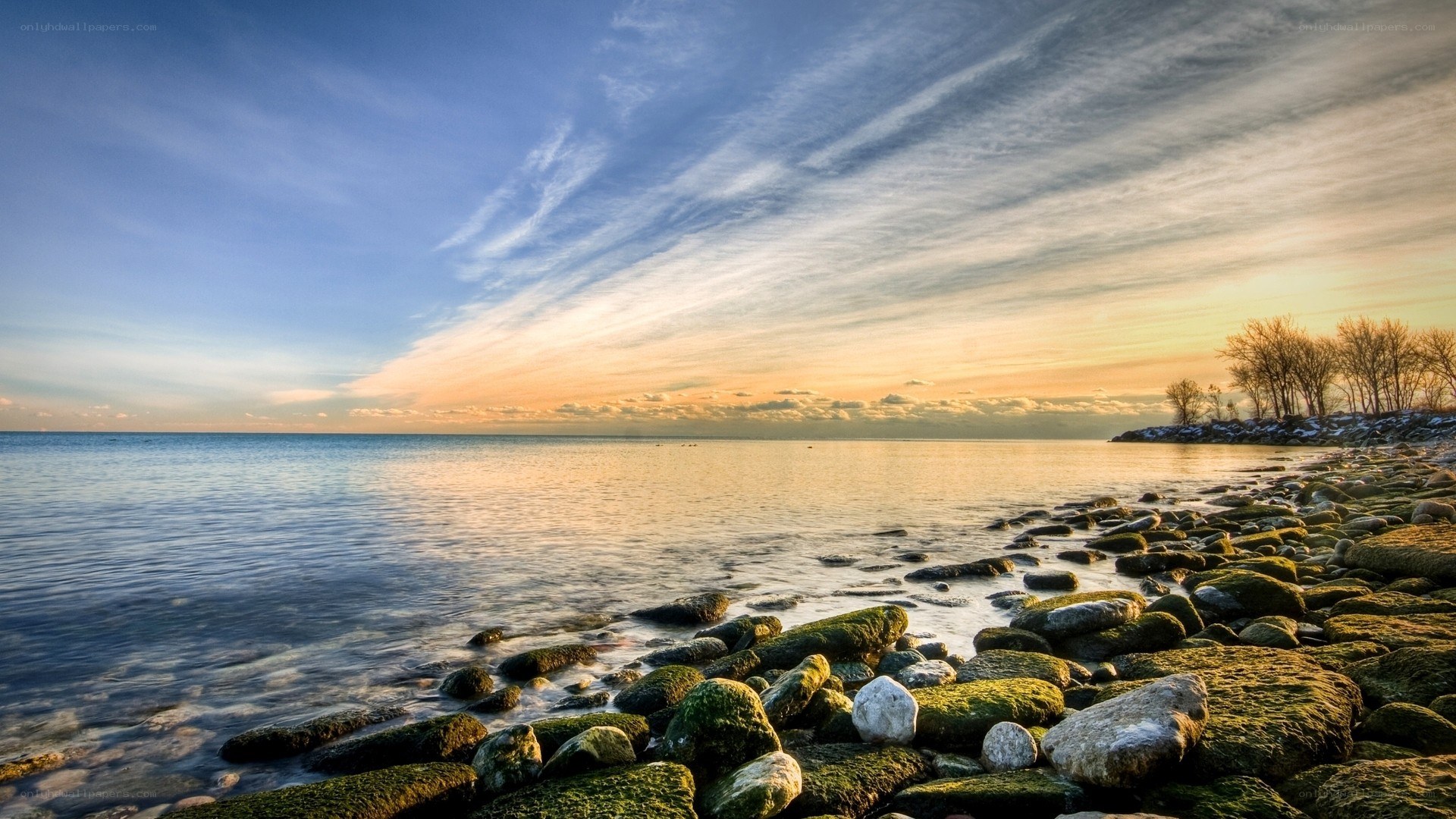 Sunset over a rocky shoreline