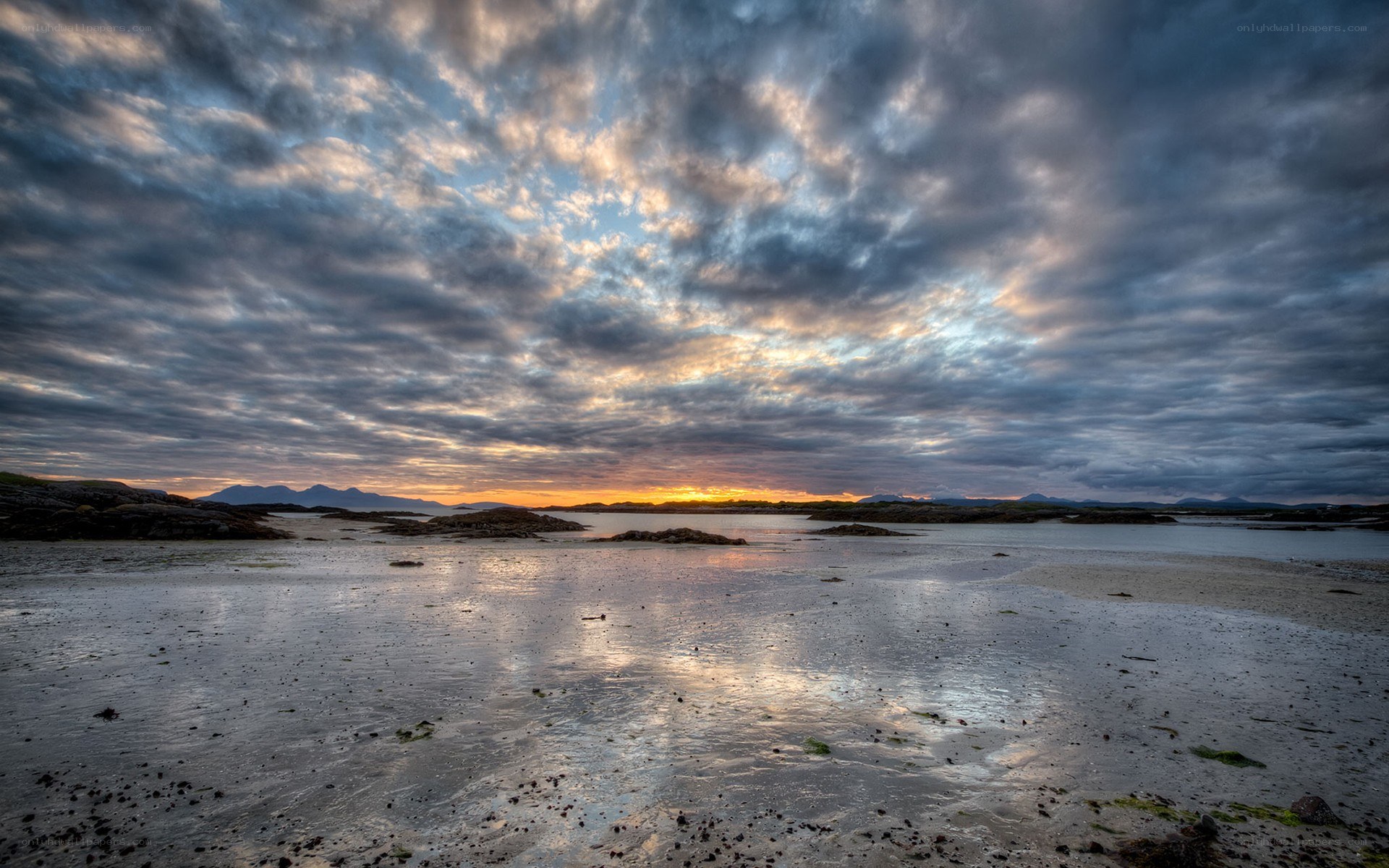 Sunset over a rocky shoreline
