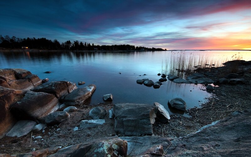 Sunset over a rocky shoreline
