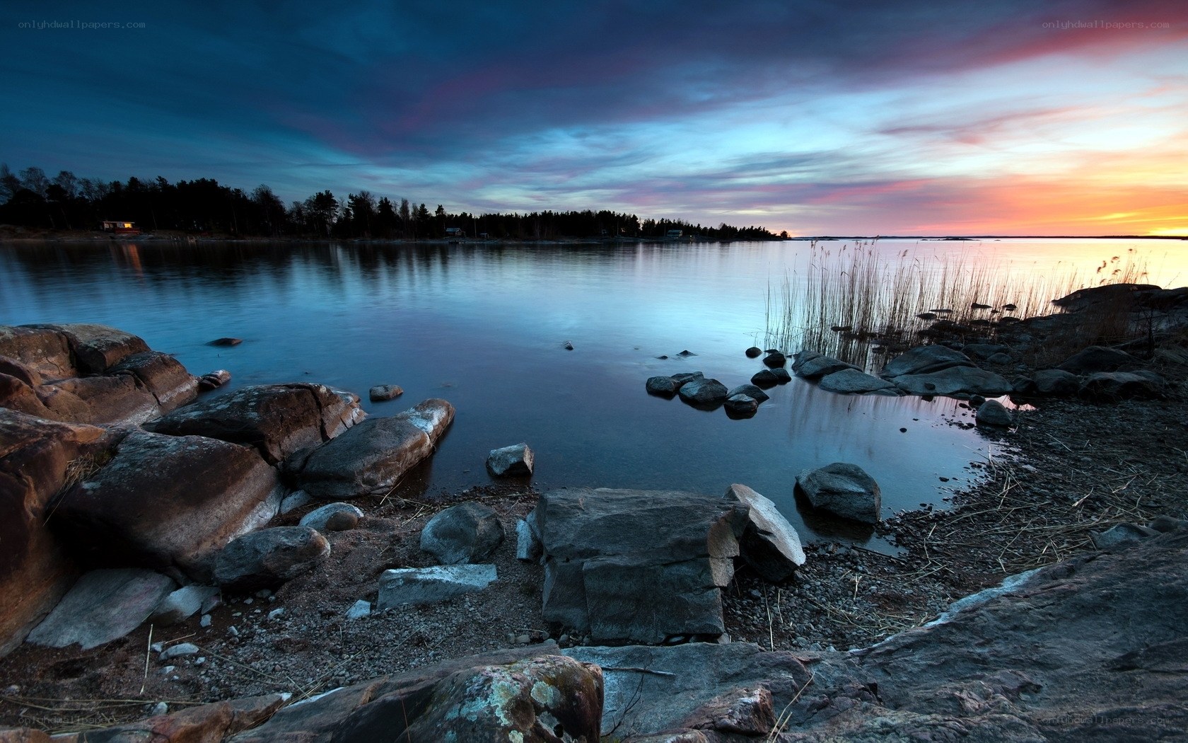 Sunset over a rocky shoreline