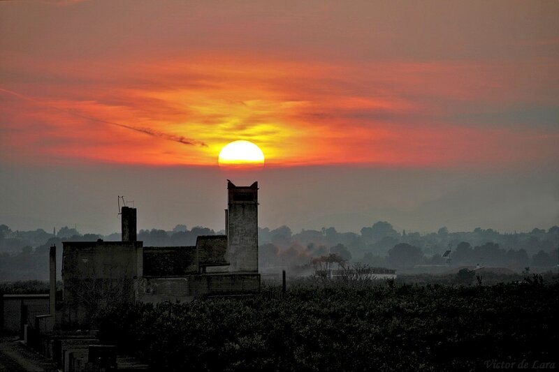 Sunset over a ruined building