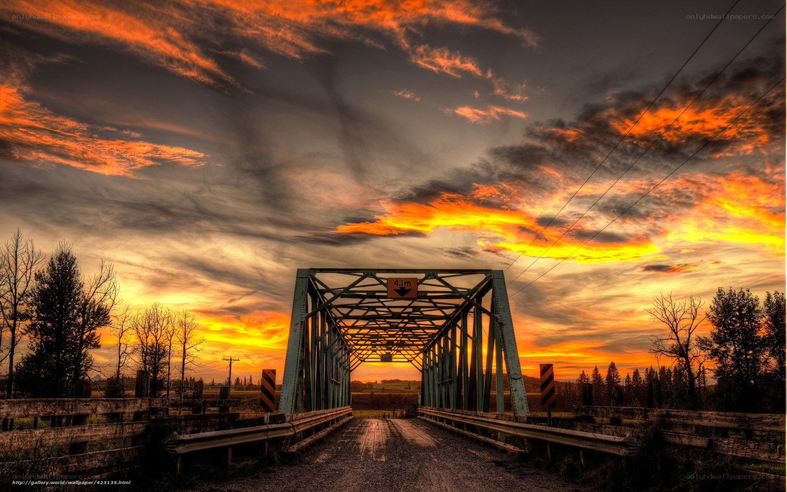 Sunset over a rural bridge