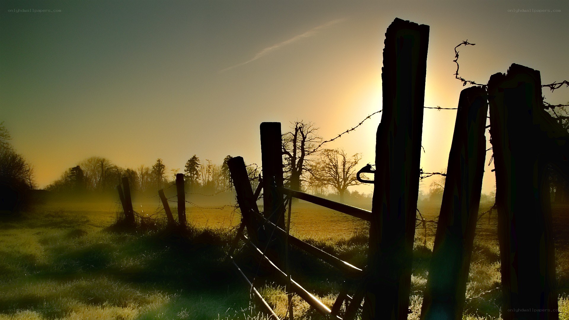 Sunset over a rural fence