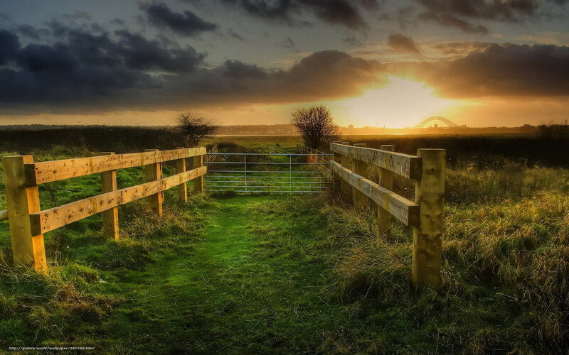 Sunset over a rural gate