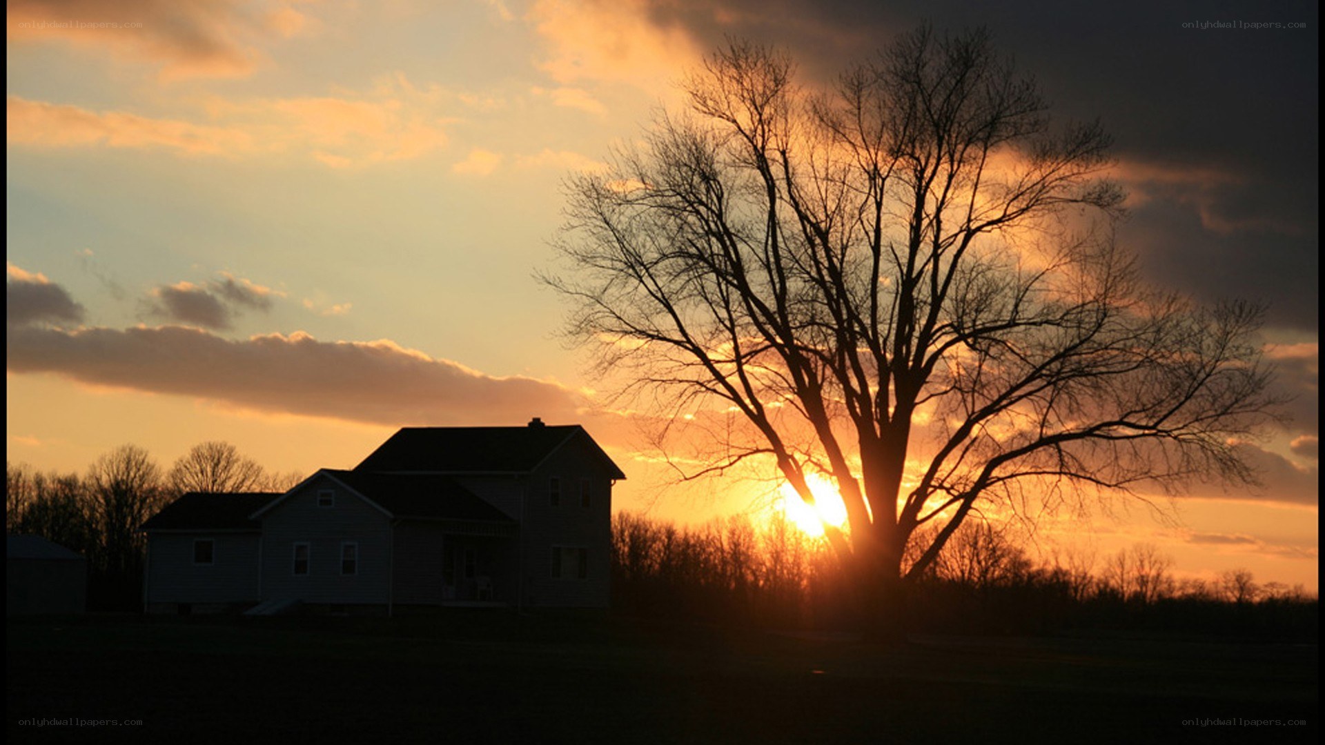 sunset over a rural house