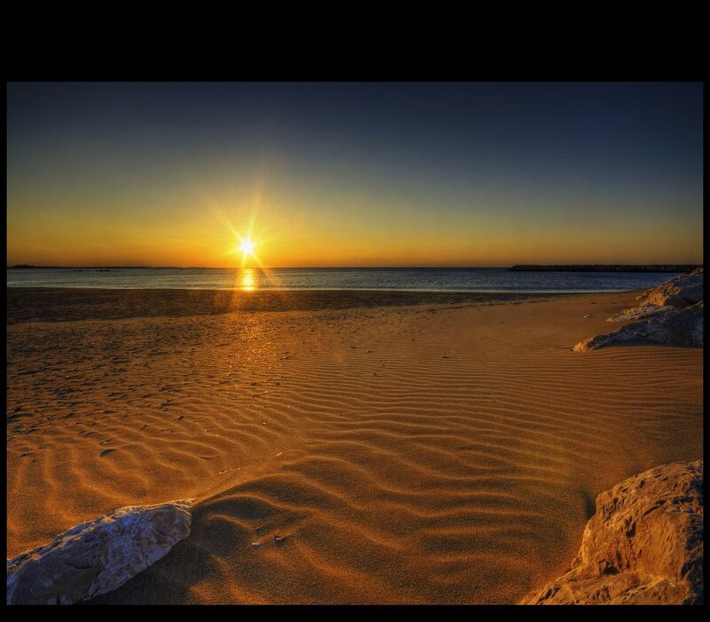 Sunset over a sandy beach