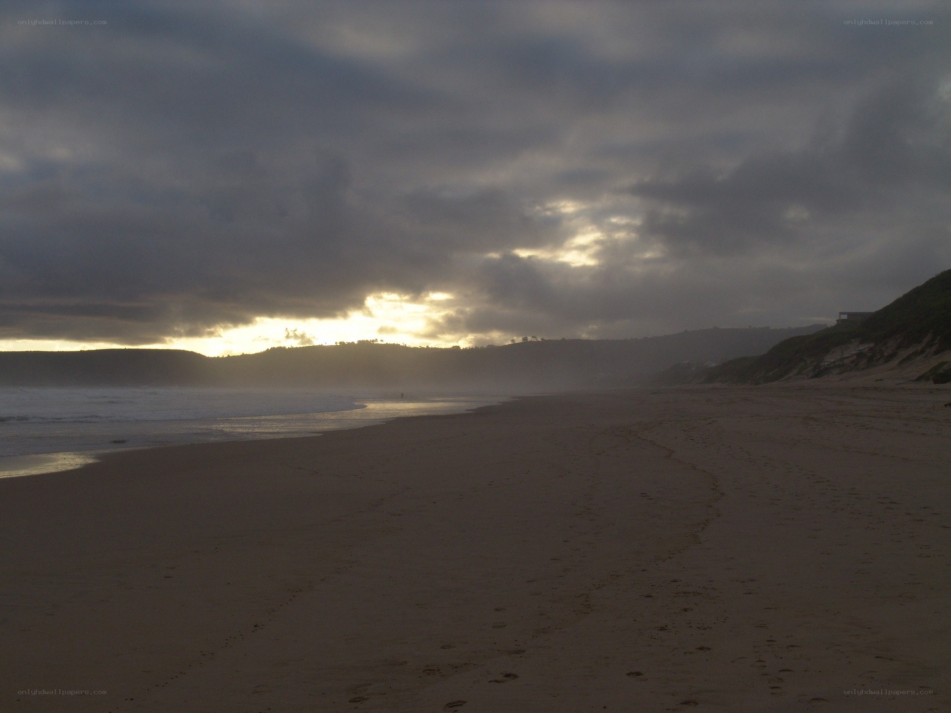 sunset over a sandy beach