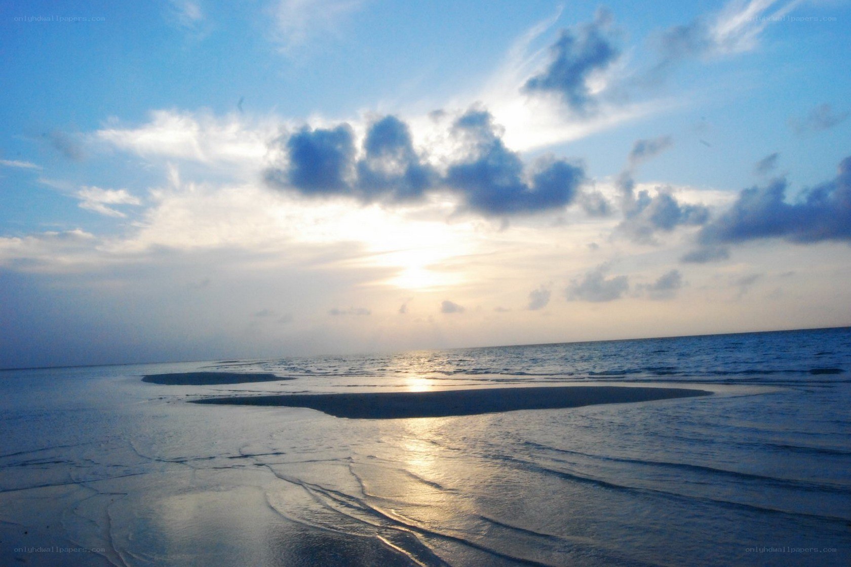 Sunset over a sandy beach