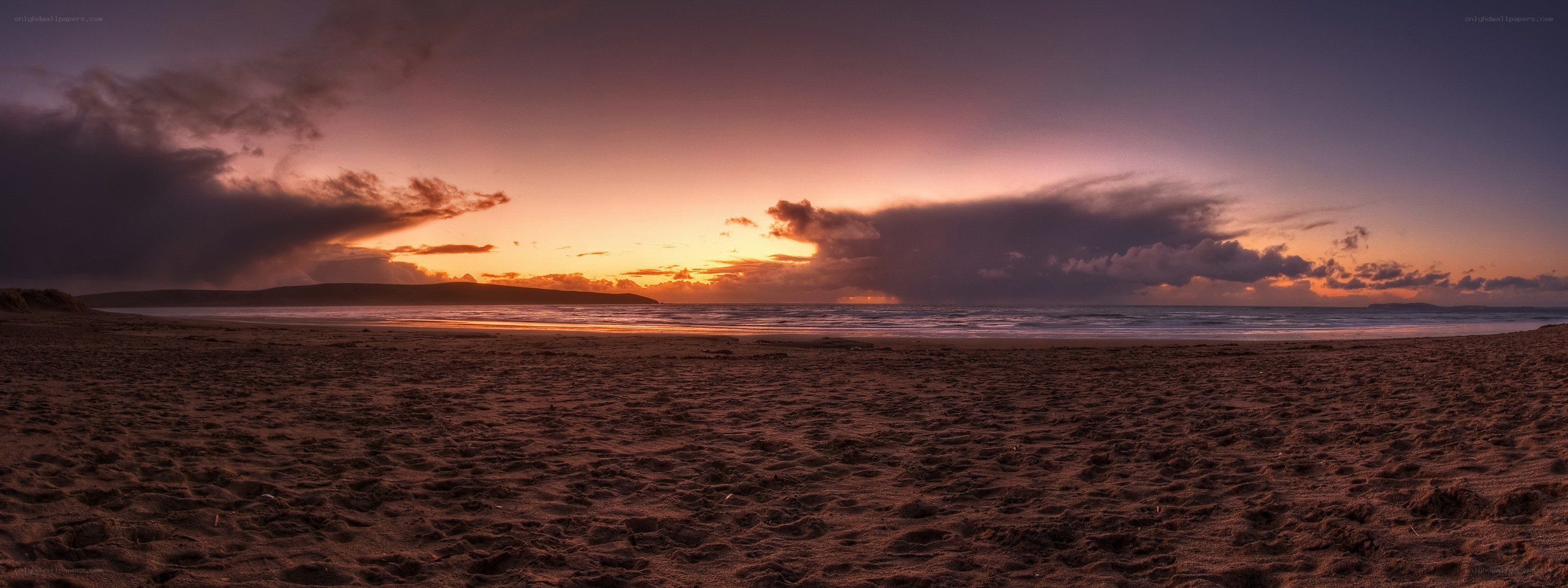 sunset over a sandy beach