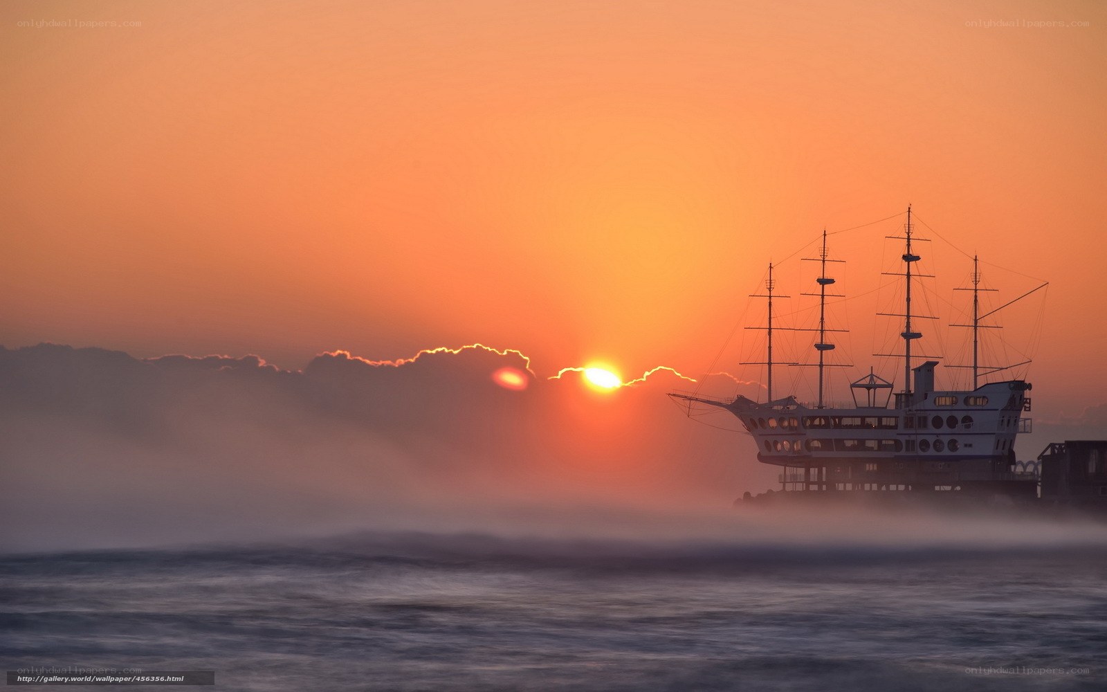 Sunset over a ship silhouette