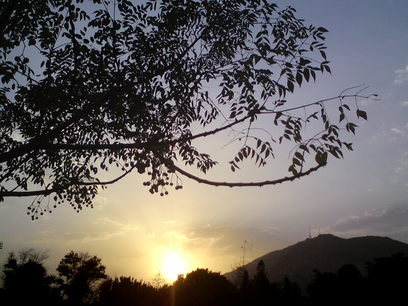 Sunset over a silhouetted hill