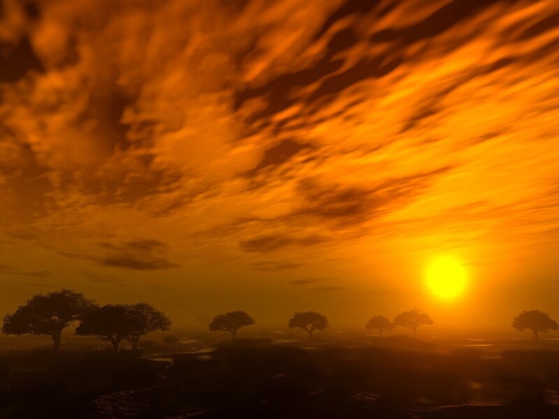 Sunset over a silhouetted landscape