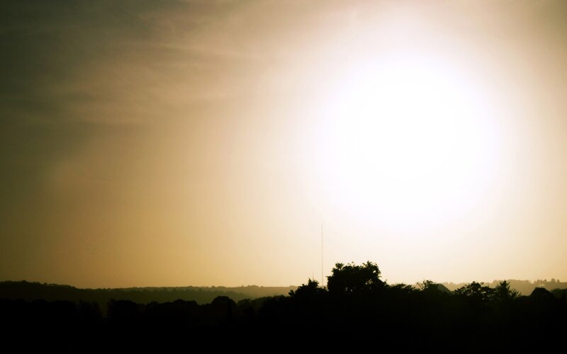 Sunset over a silhouetted landscape