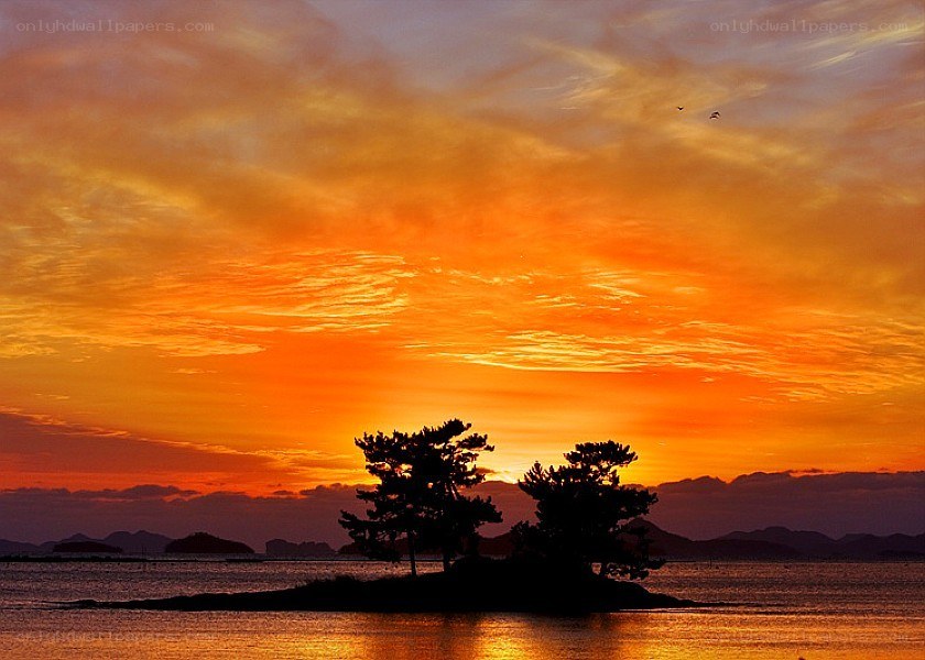 sunset over a small island