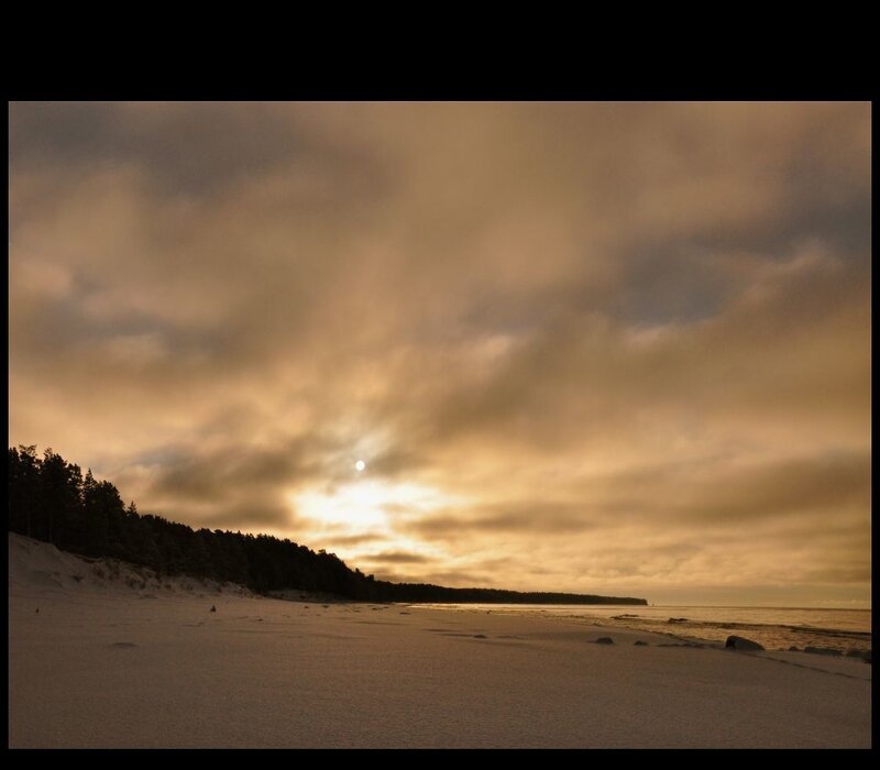 Sunset over a snowy beach