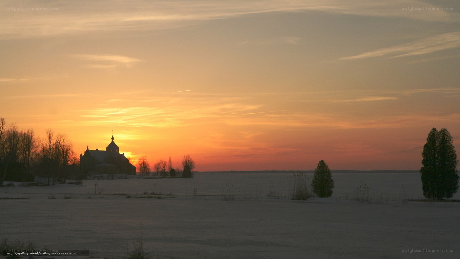Sunset over a snowy church