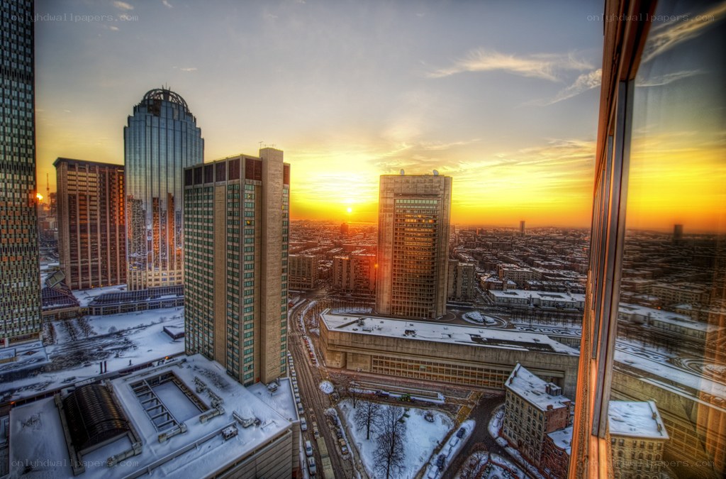 Sunset over a snowy city