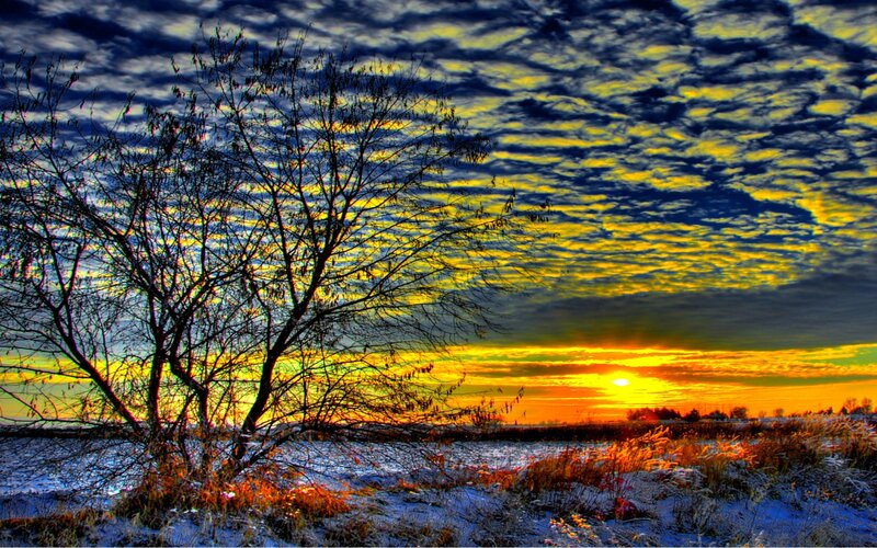 Sunset over a snowy field