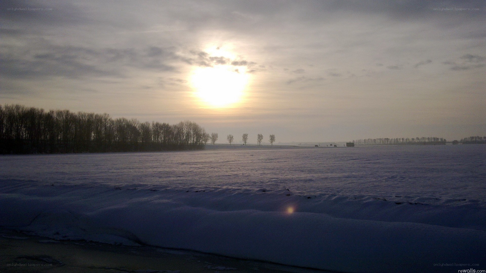 Sunset over a snowy field