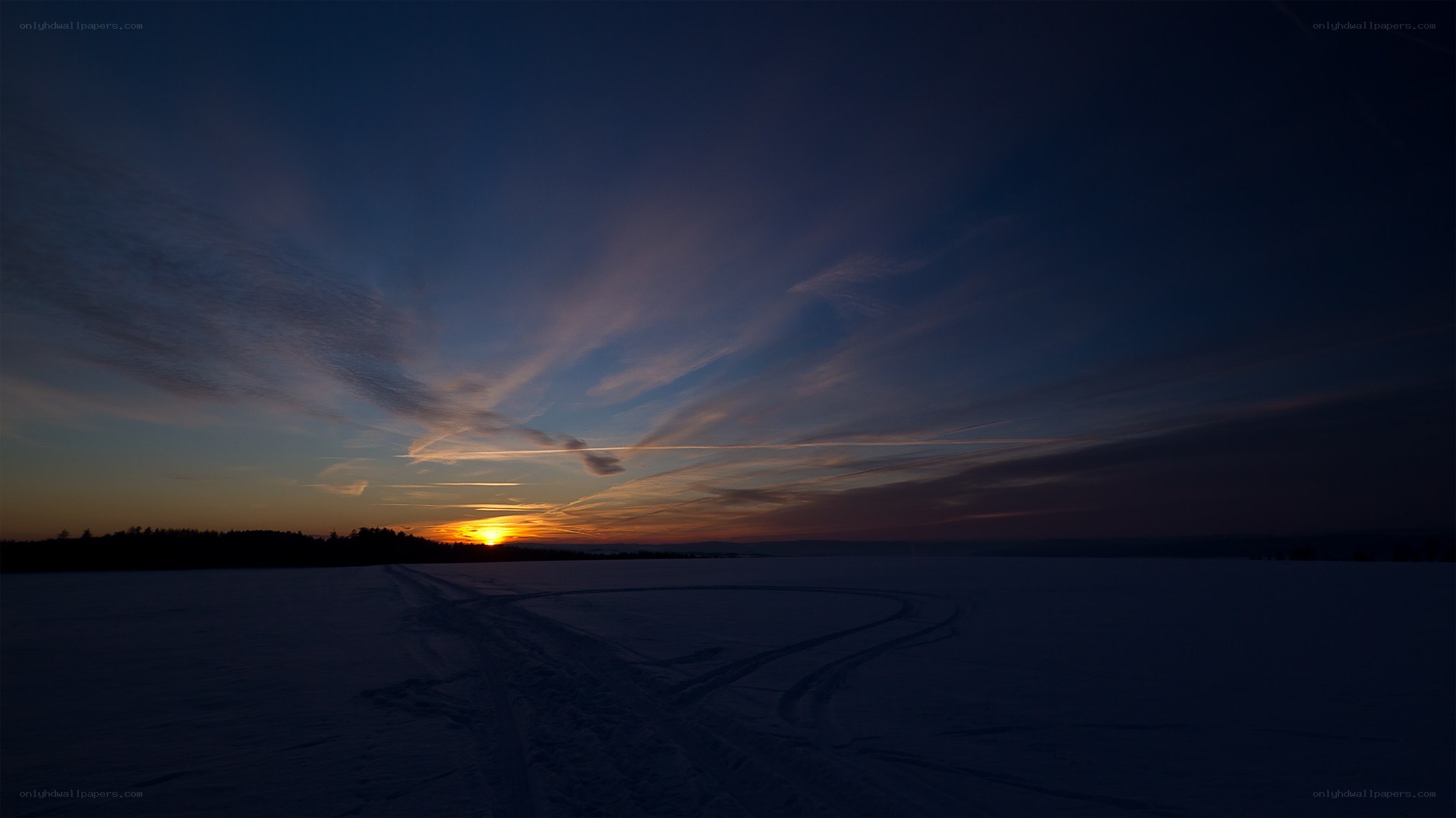 Sunset over a snowy field
