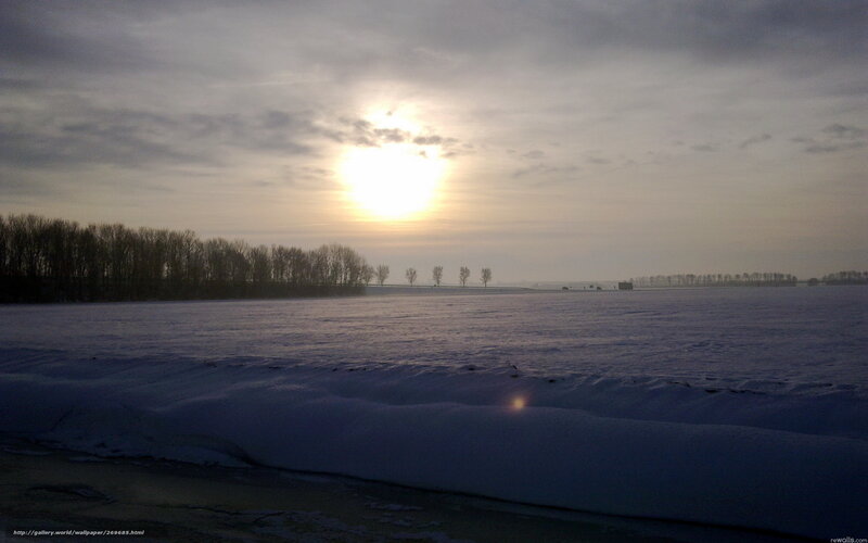 Sunset over a snowy field