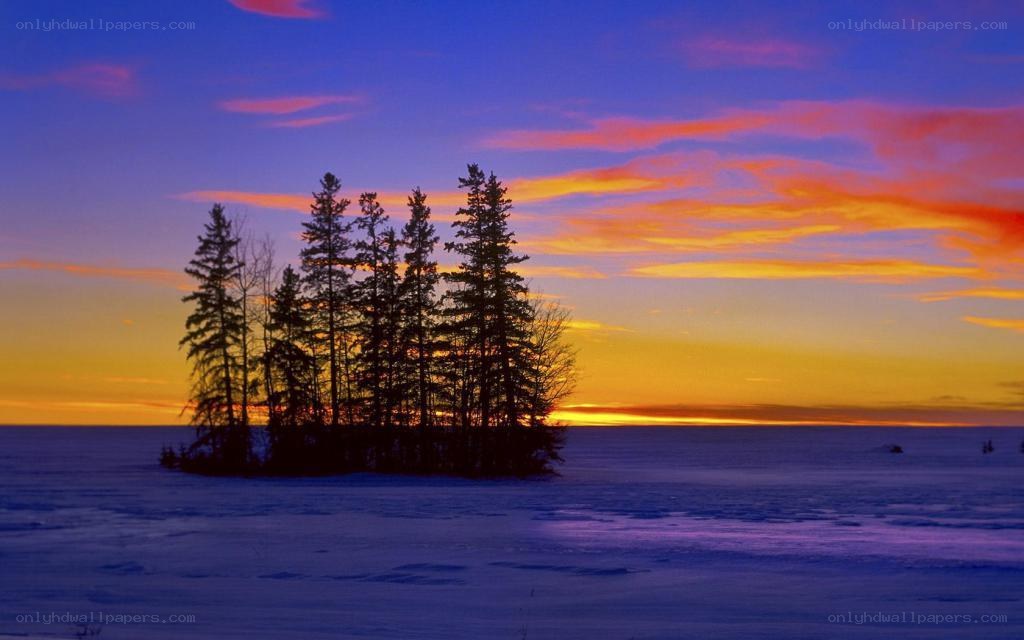Sunset over a snowy island