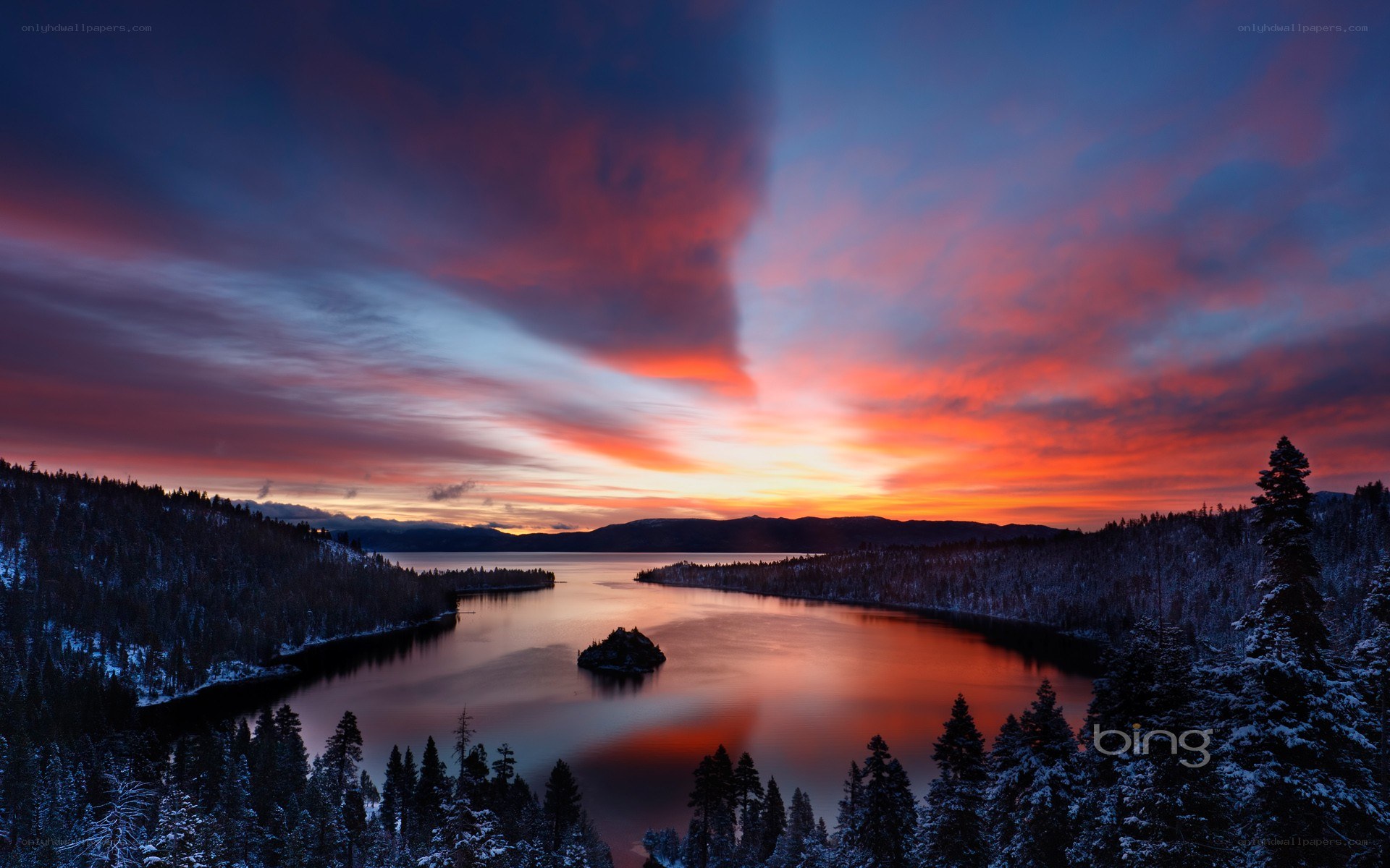 sunset over a snowy lake