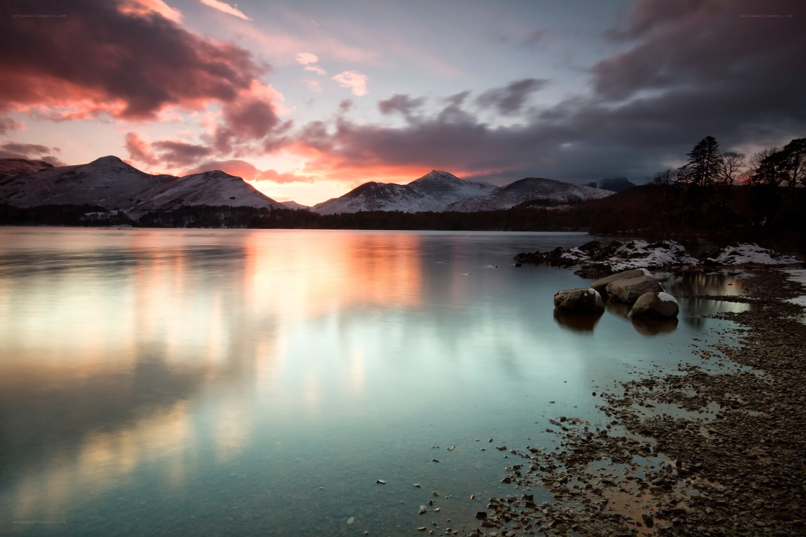 Sunset over a snowy lake