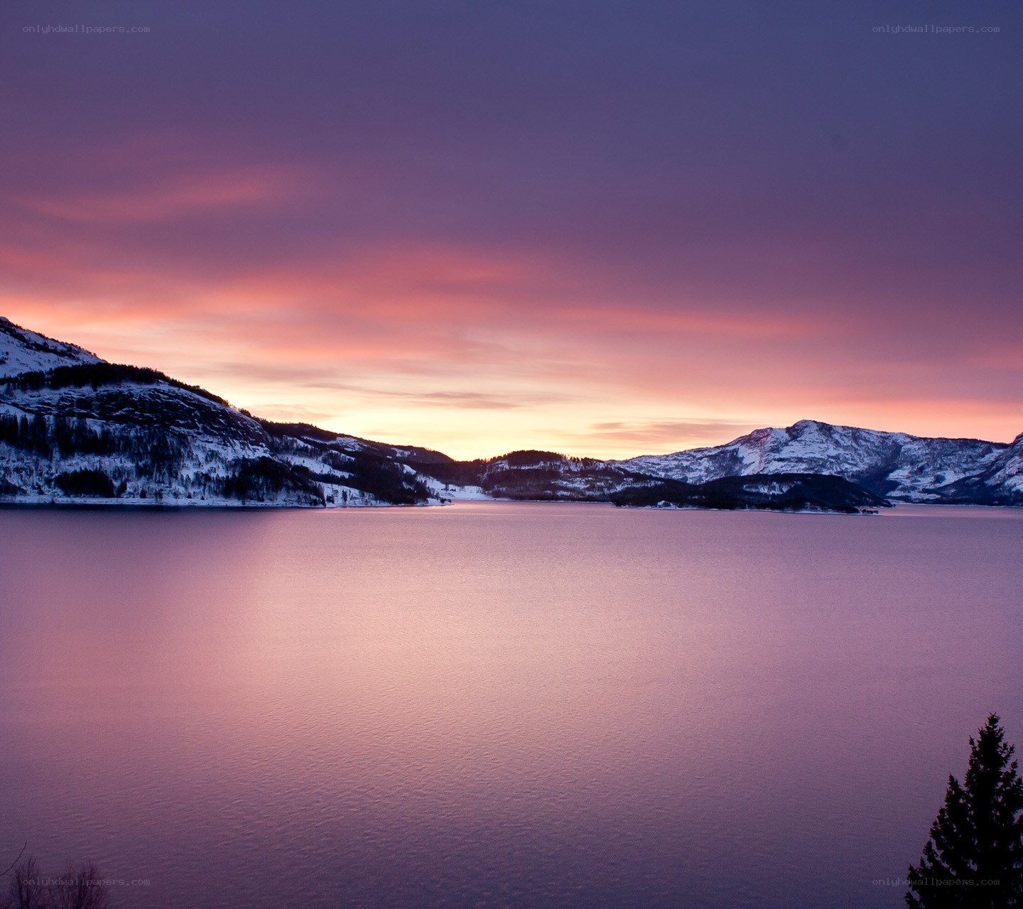 Sunset over a snowy lake