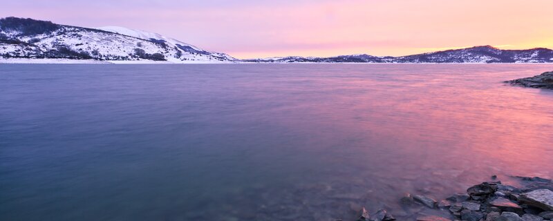 Sunset over a snowy lake