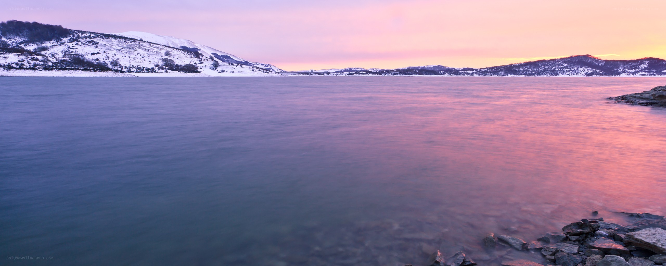 Sunset over a snowy lake