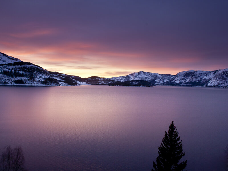 sunset over a snowy lake