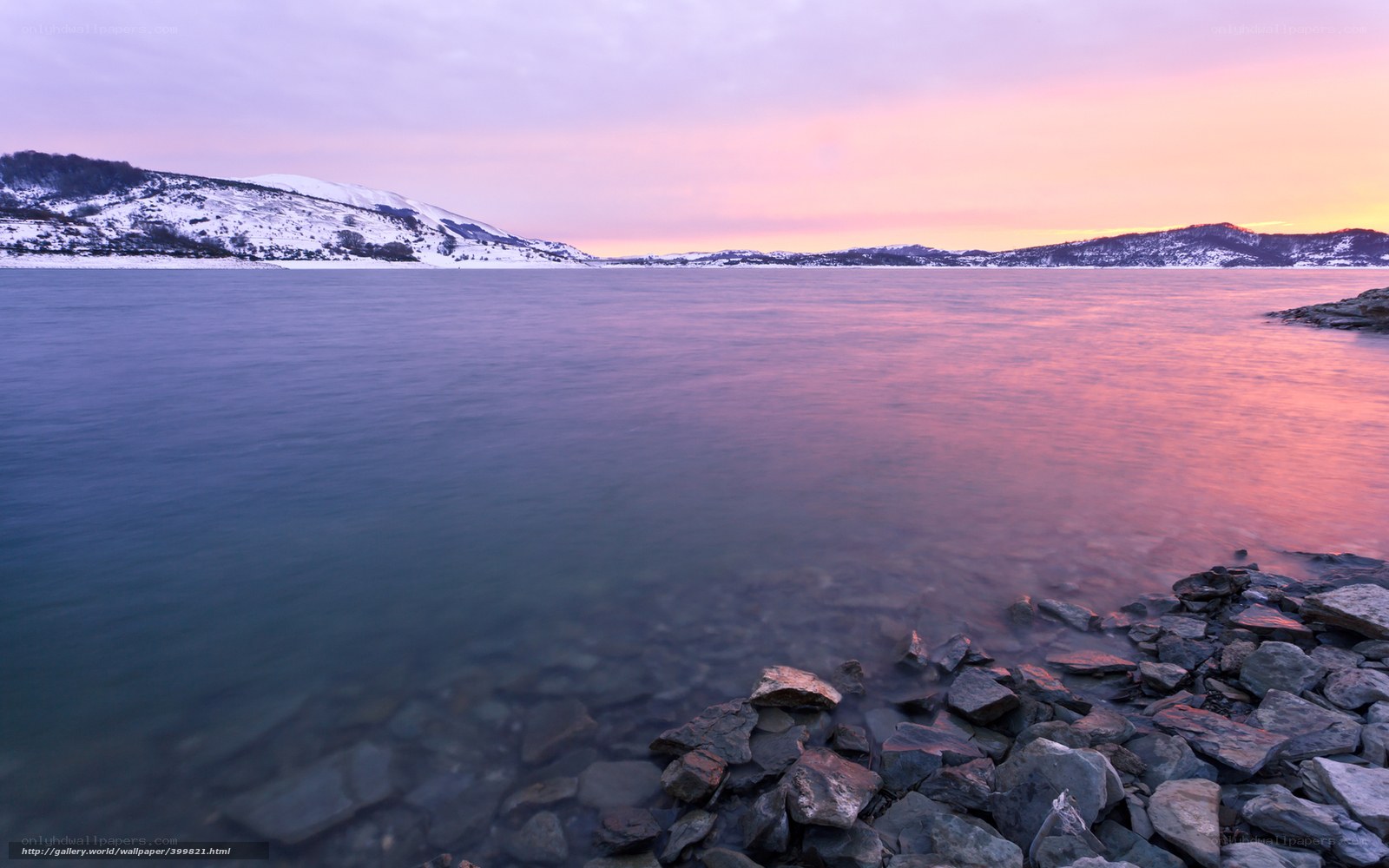 Sunset over a snowy lake
