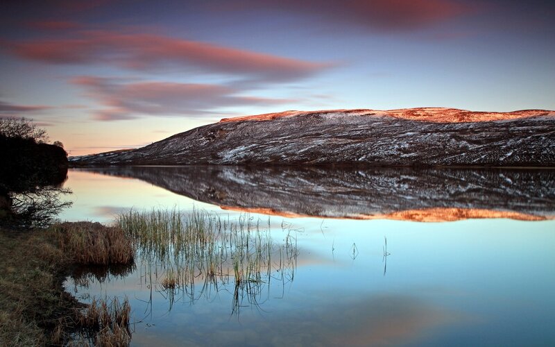 Sunset over a snowy lake