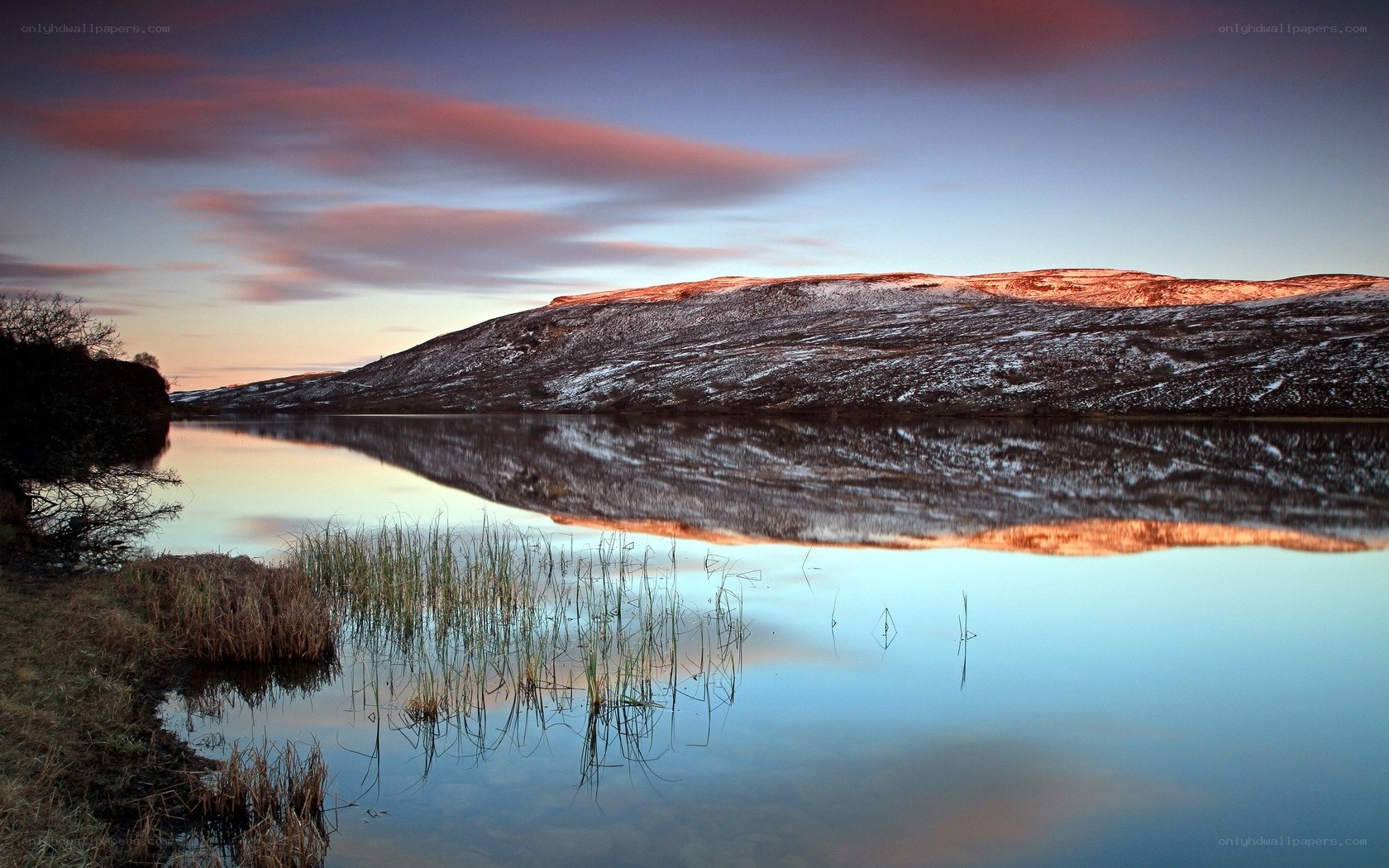 Sunset over a snowy lake