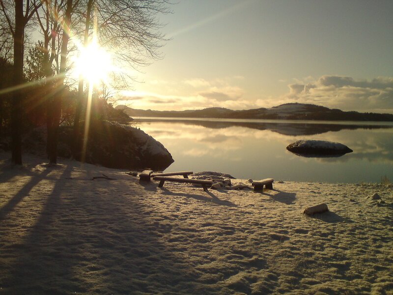 Sunset over a snowy lakeside