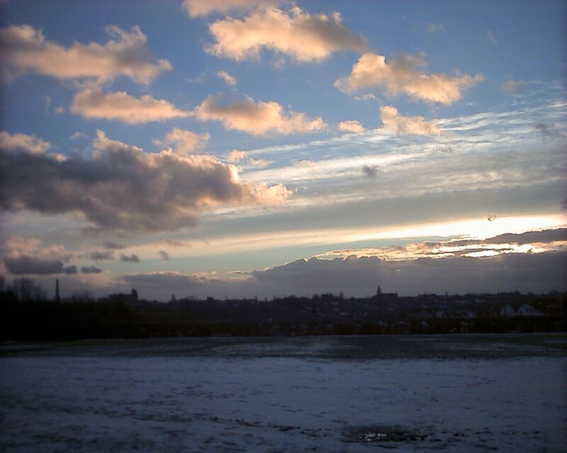 sunset over a snowy landscape