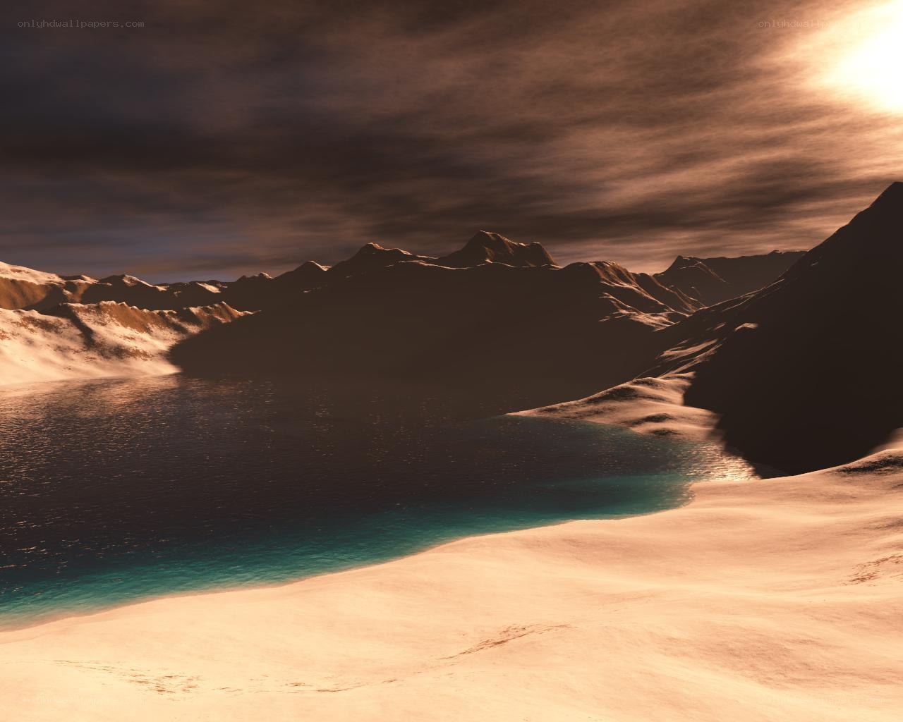 sunset over a snowy mountain lake