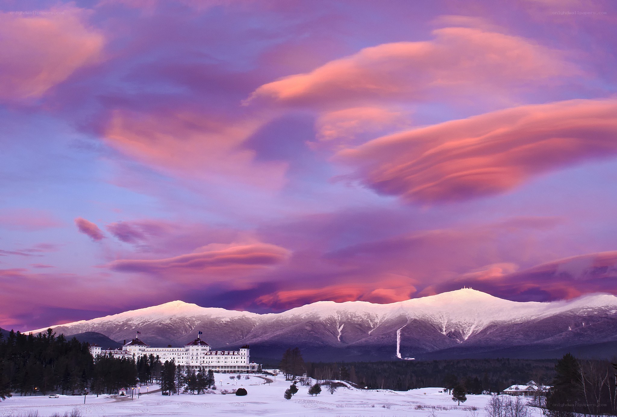 Sunset over a snowy mountain resort