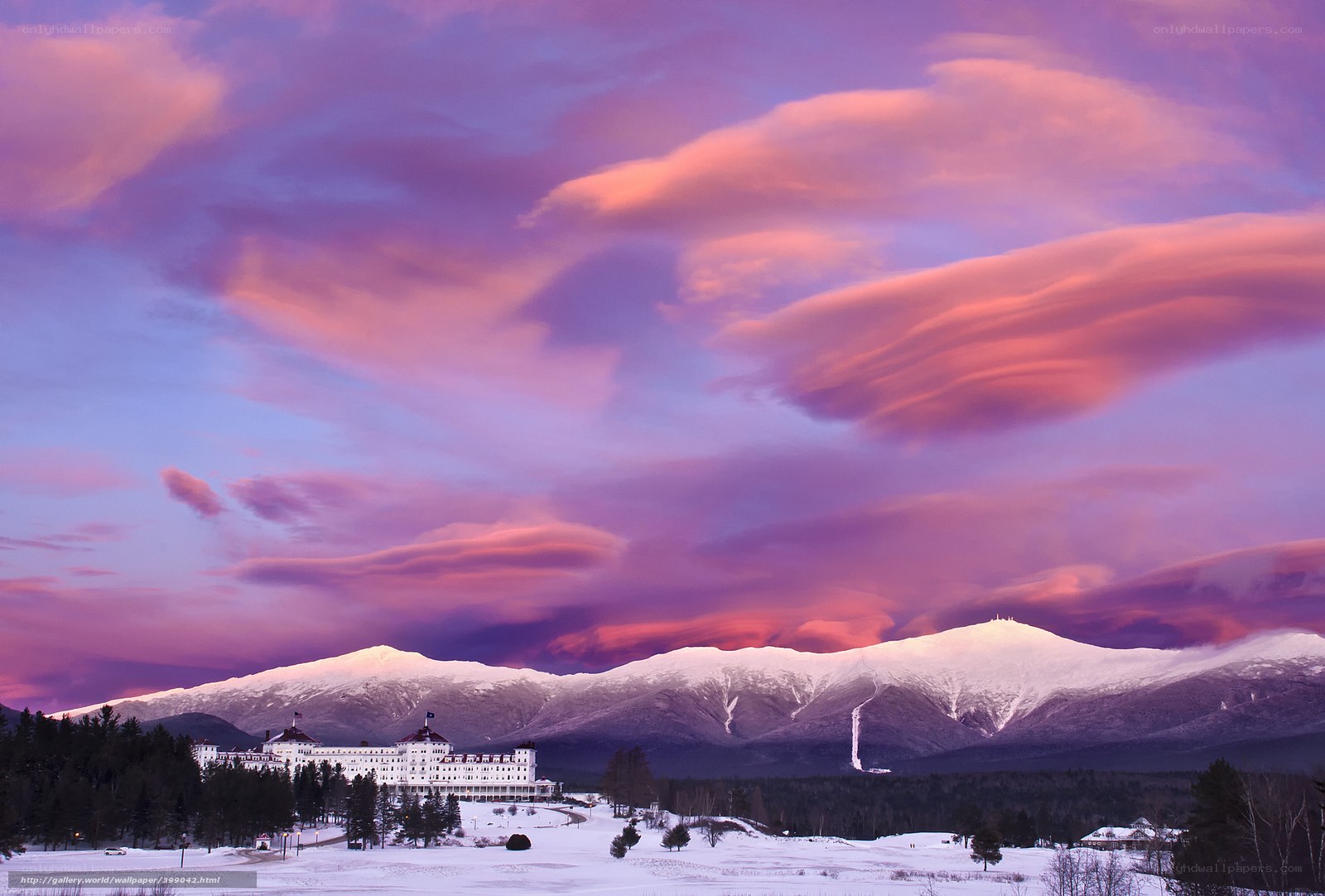 Sunset over a snowy mountain resort