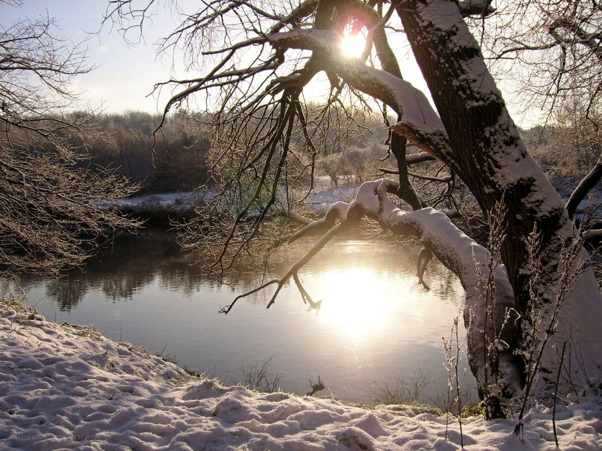 Sunset over a snowy river