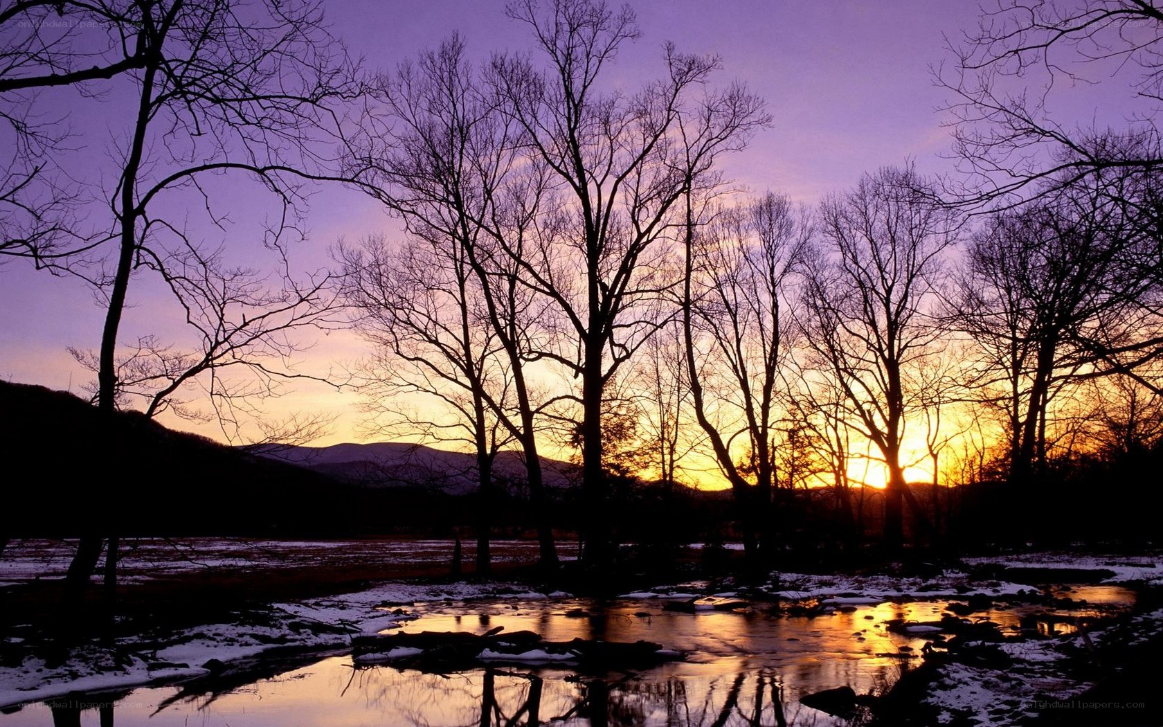 Sunset over a snowy river